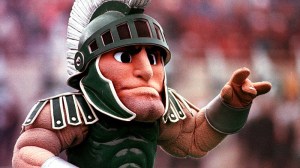 Sparty, the Michigan State University mascot entertains fans in November 1998 in East Lansing, Mich. Some MSU fans suggest the school's other mascot, the Spartan Chariot driven by Mike Hall and led by white Arabian horses, could give MSU's foam rubber mascot a run for his money. (AP Photo/Carlos Osorio)